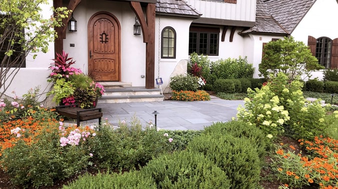 gardens in front of house leading to front door
