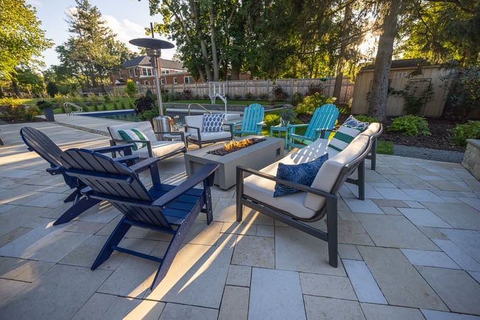 Residential landscape design patio with seating and fire feature