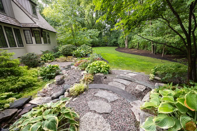 paver pathway leading to backyard