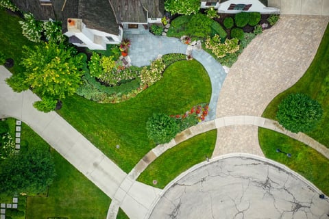 Residential front yard with aeriel view of driveway and roundabout