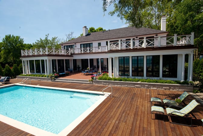 backyard pool with wood deck surround 