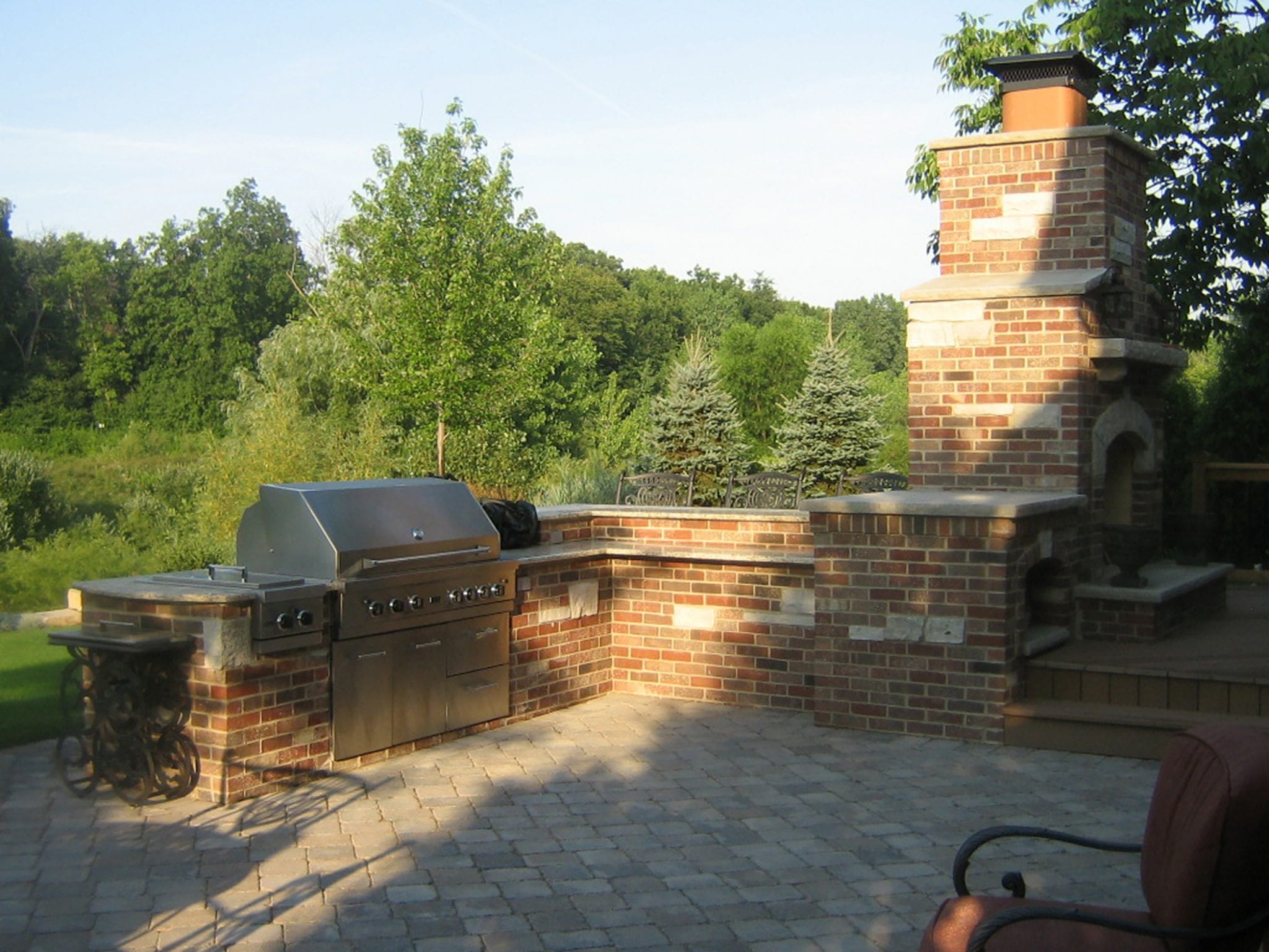 brick kitchen and fireplace in backyard