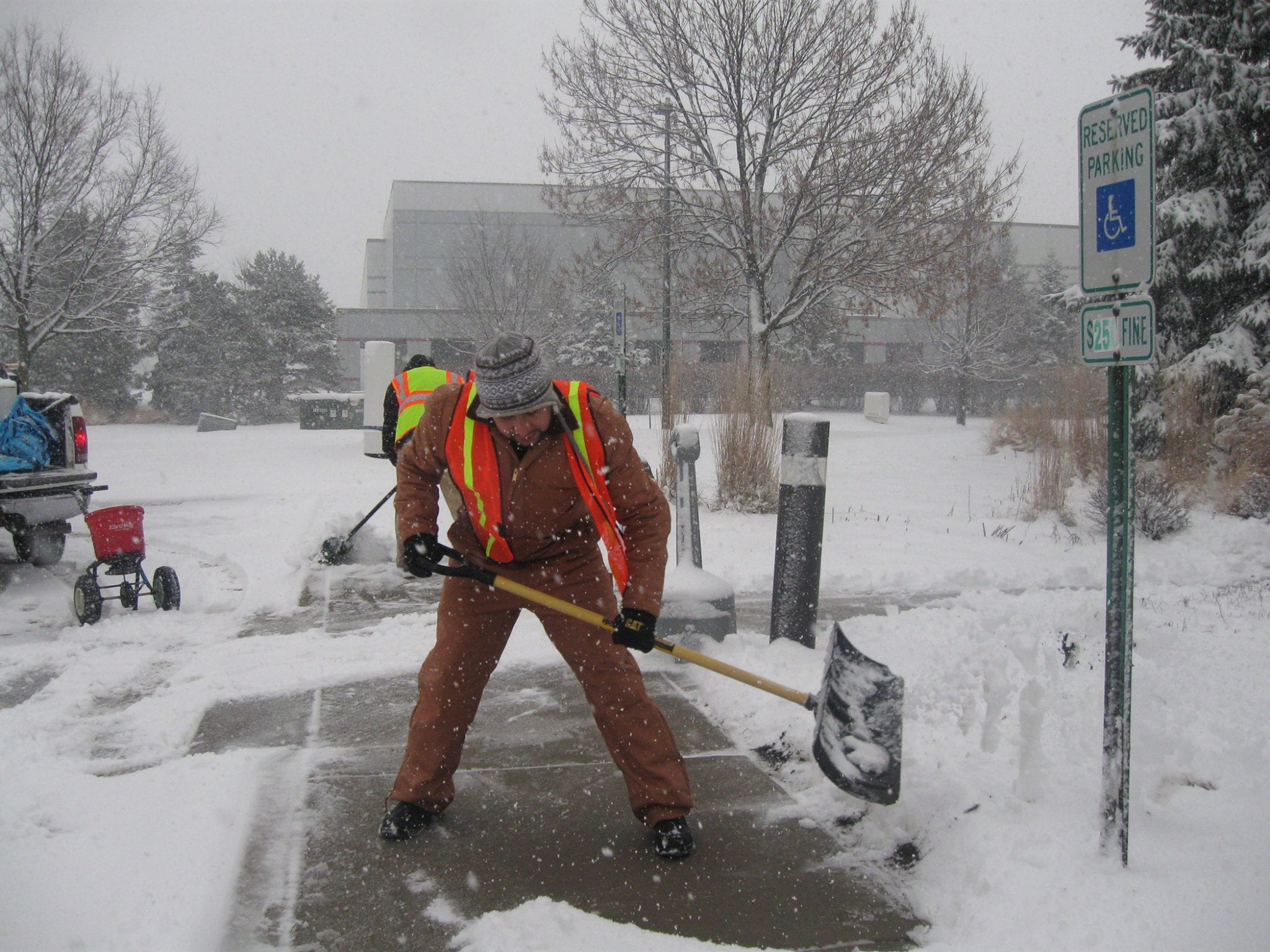 crew members shoveling snow in winter