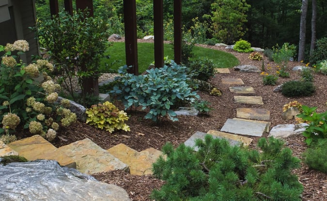 huge stone slab stairs leading to backyard