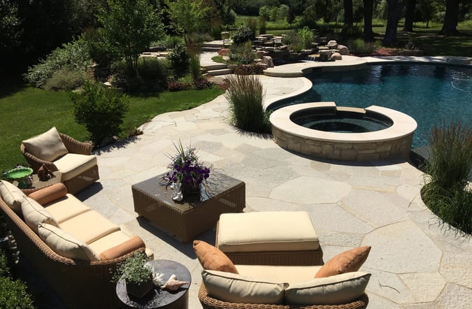 patio looing over backyard pool and waterfall