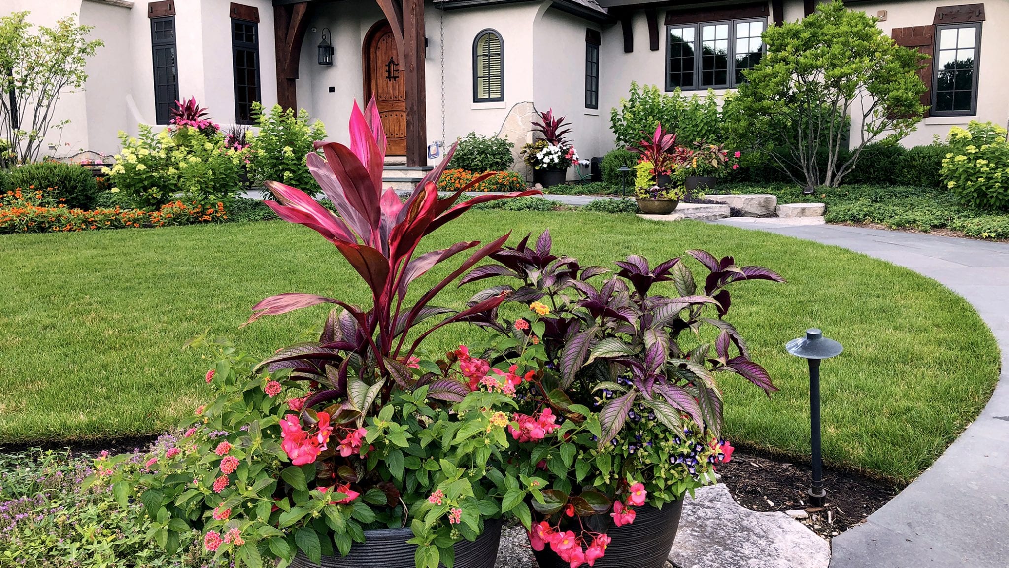 container gardens in front of house