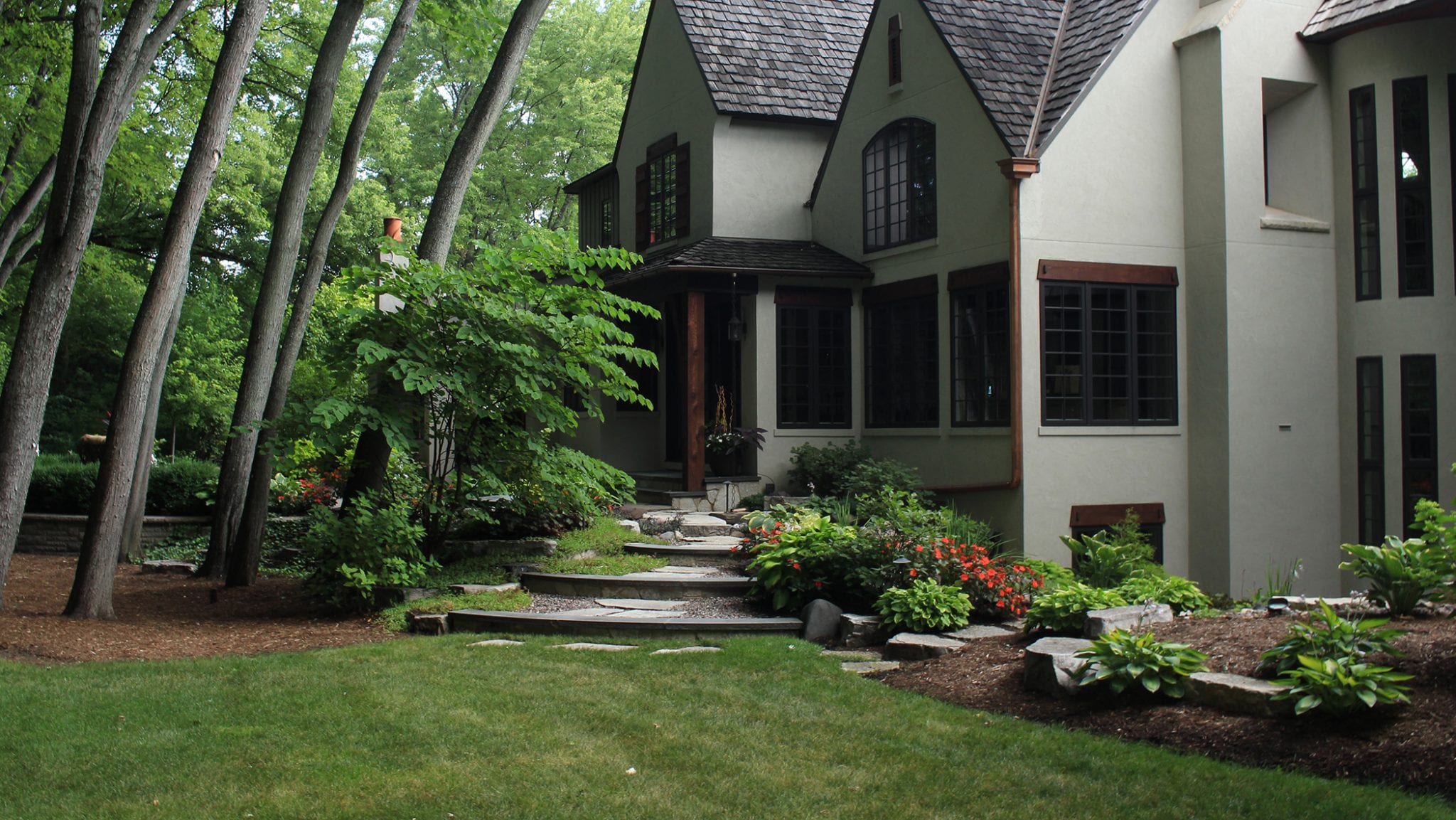 shaded back yard with garden beds