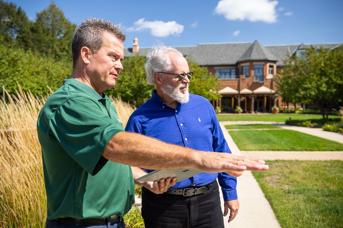 account manager and client looking at property