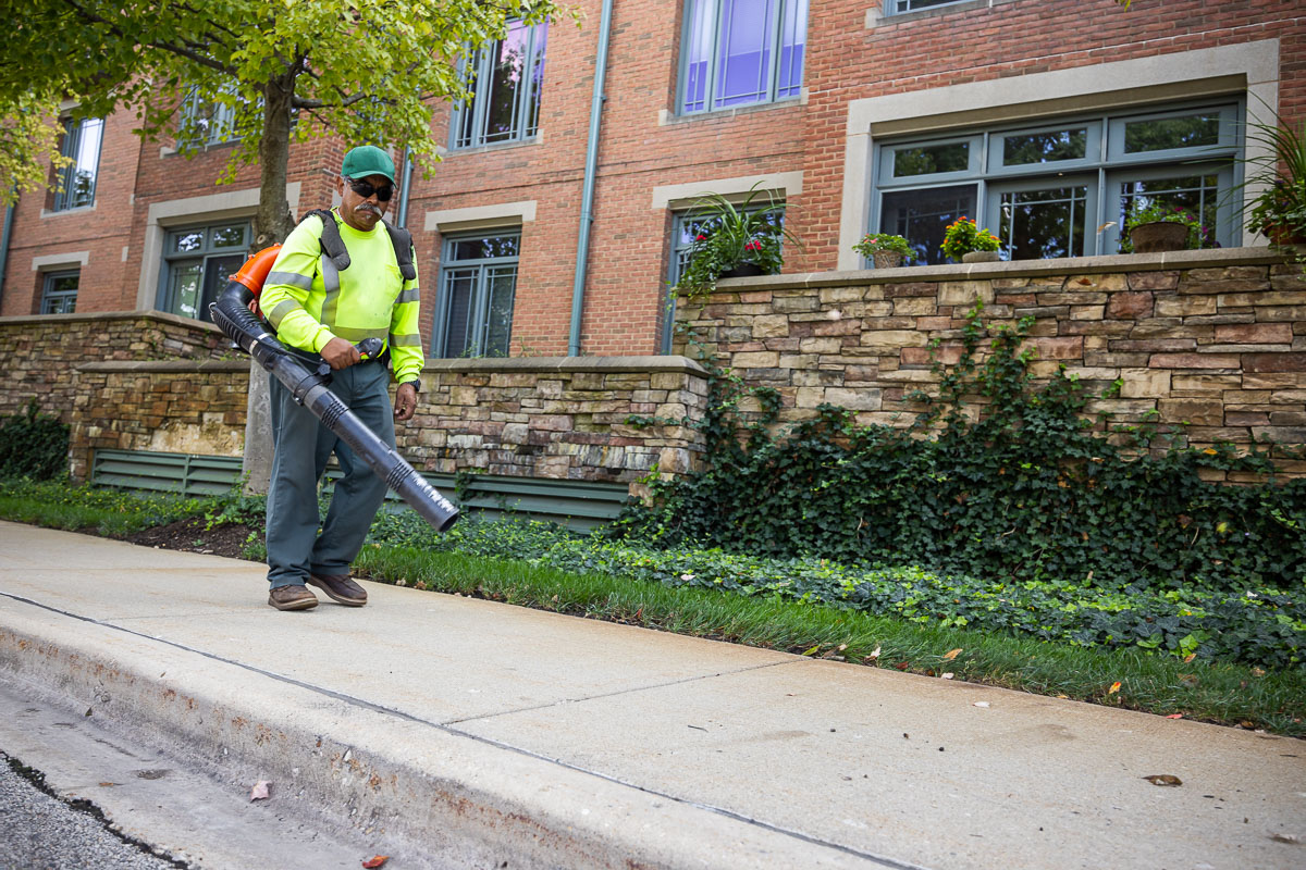 commercial landscape maintenance retirement crew clearing off sidewalks 1