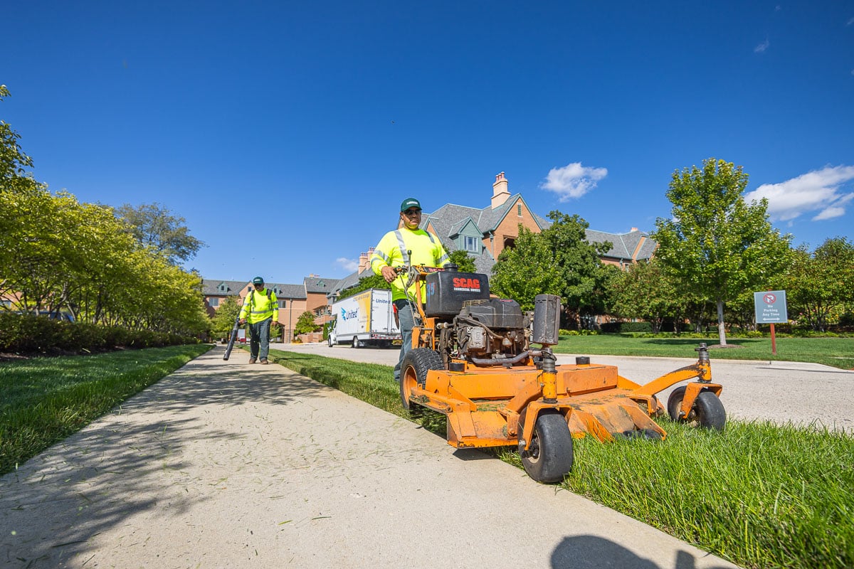 landscape crew mowing lawn