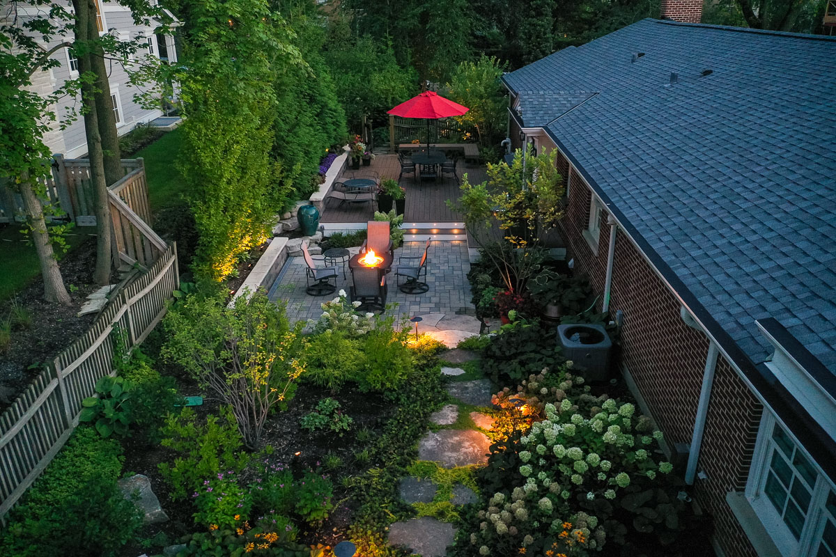 residential landscape design backyard view with landscape lighting 