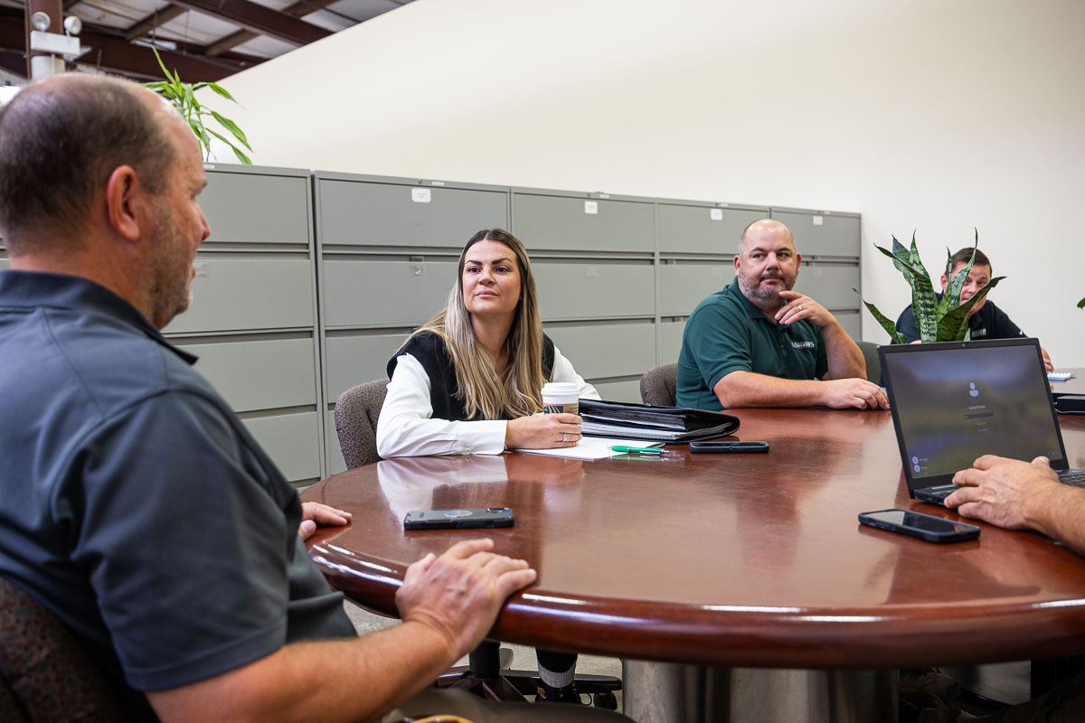 team meeting around conference table 4