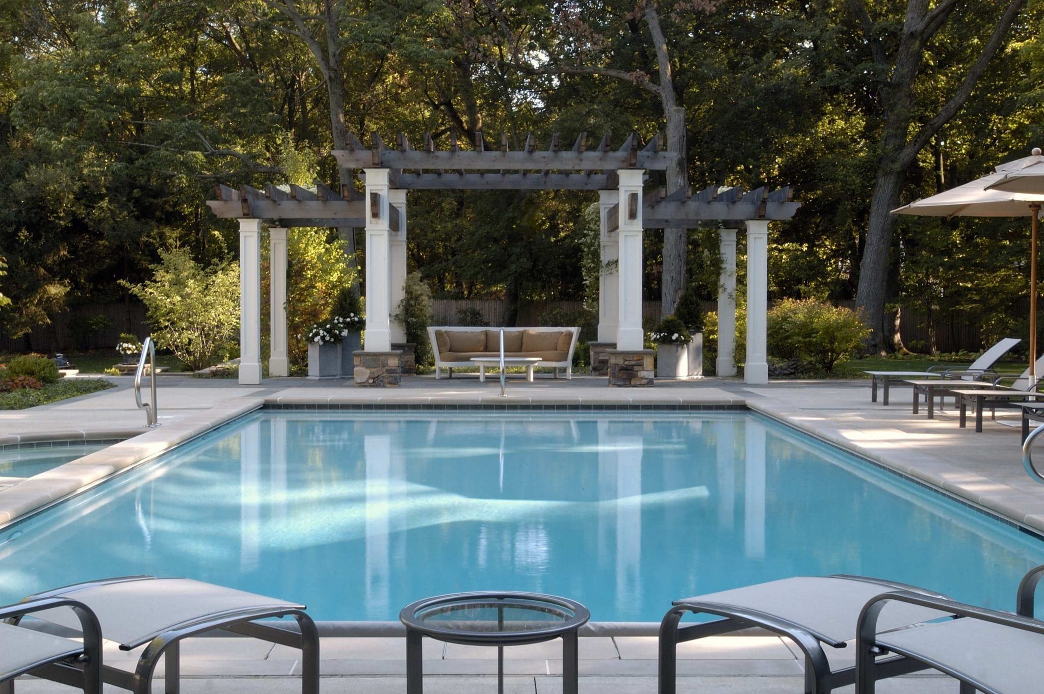 backyard pool with pergola