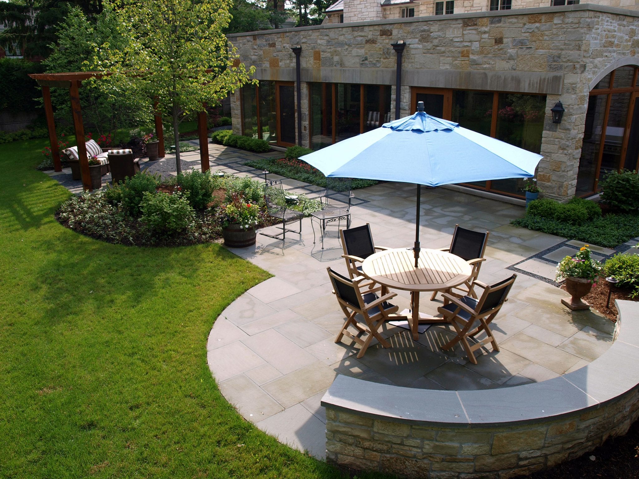 flagstone patio with curved wall around seating area