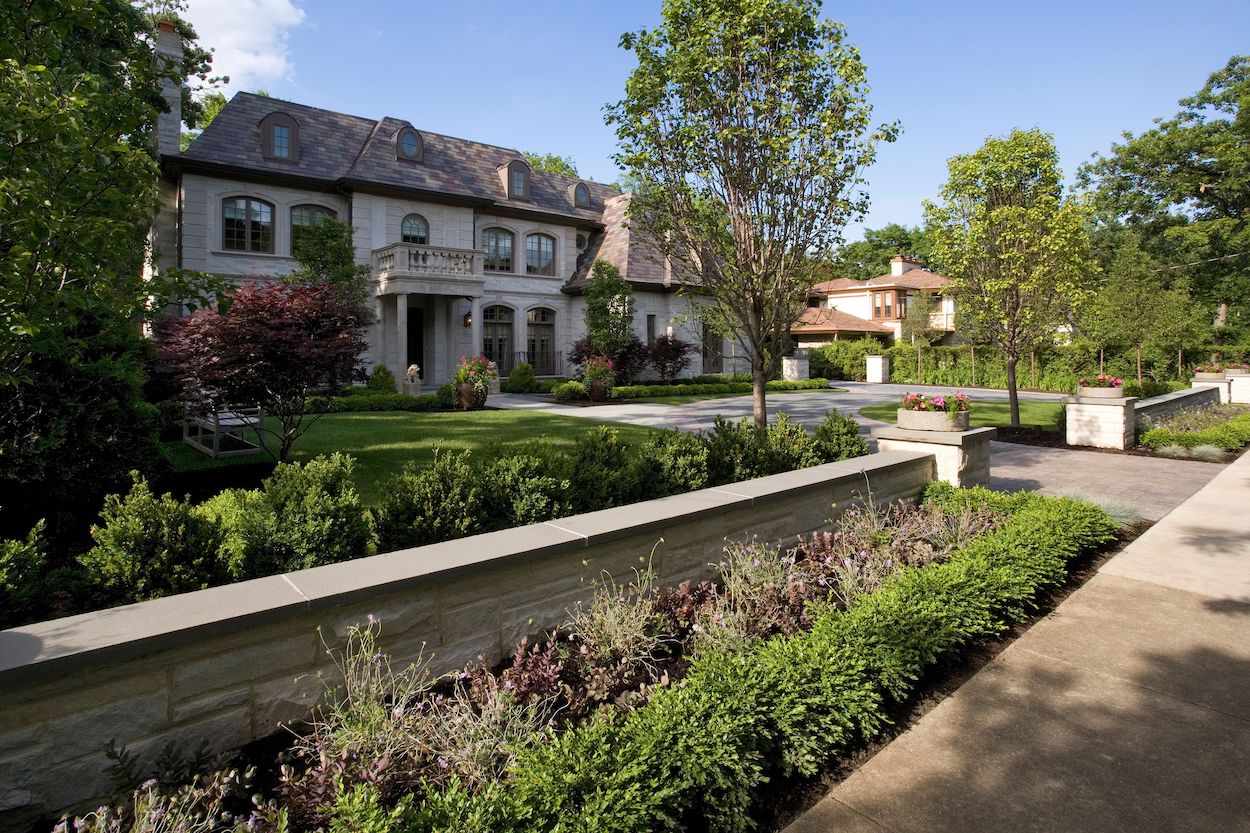 front of house with drivway wall 