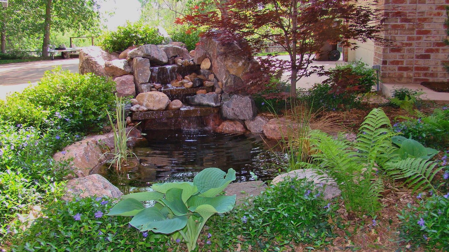 water feature with waterfall in yard 